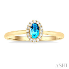 5x3 MM Oval Shape Blue Topaz and 1/20 Ctw Round Cut Diamond Halo Semi-Precious Ring in 10K Yellow Gold