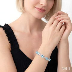 7X7 MM Cushion Shape Blue Topaz and 1/20 Ctw Round Cut Diamond Fashion Bracelet in Sterling Silver