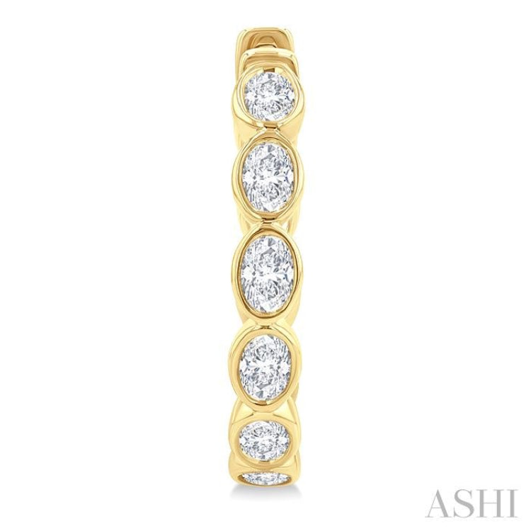 1 1/10 Ctw Bezel Set Oval Cut Diamond Fashion Hoop Earrings in 14K Yellow Gold